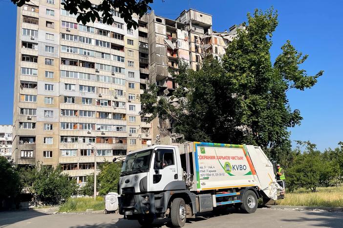 Andrey Taranenko drives a municipal garbage truck through the Saltivka neighborhood of Kharkiv.