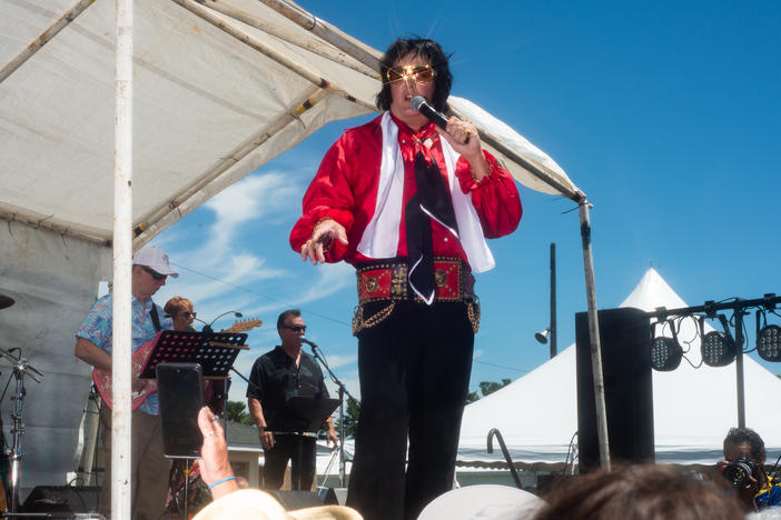 Matt King performs onstage at the Michigan Elvisfest in Belleville, Mich., on Saturday, July 9. King has been performing as Elvis for 30 years; his first performance was when he was 14.