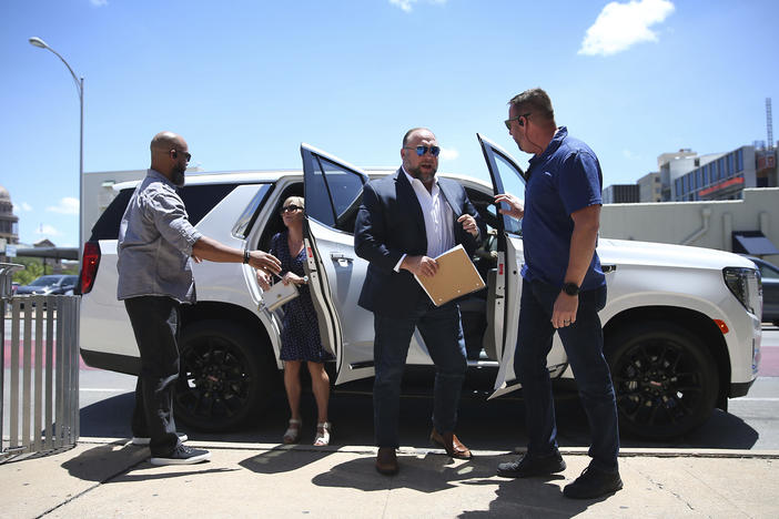 Alex Jones arrives at the Travis County Courthouse in Austin on Tuesday.