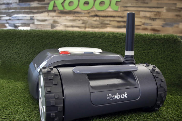 An iRobot Terra lawn mower is shown in Bedford, Mass., on Jan. 16, 2019. Amazon on Friday announced an agreement to acquire iRobot for approximately $1.7 billion. iRobot sells its robots worldwide and is most famous for the circular-shaped Roomba vacuum.