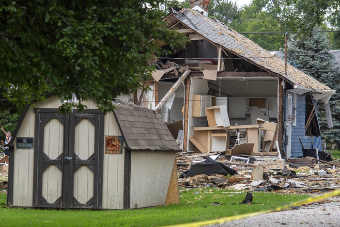 Emergency crews respond to a house explosion Wednesday in Evansville, Ind. (MaCabe Brown/Evansville Courier & Press via AP)