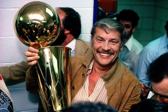 Los Angeles Lakers owner Jerry Buss poses with the NBA Championship trophy after Game 6 of the NBA Finals with the Los Angeles Lakers and the Philadelphia 76ers on May 16, 1980 at the Spectrum in Philadelphia, Pennsylvania.