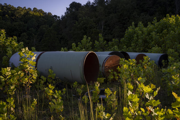 Pipes that have been sitting for four years on the property of impacted landowner Maury Johnson, in Greenville, W.Va., on Thursday, Sept. 1, 2022.