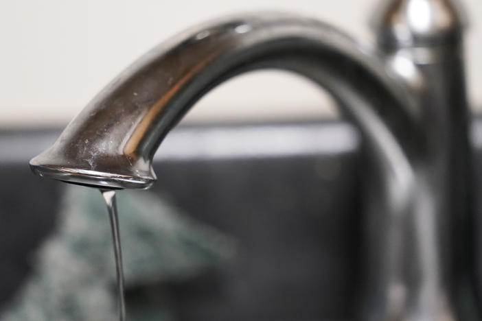 A trickle of water comes out of the faucet in a Senior Living apartment in Jackson, Miss., earlier this month. A recent flood worsened Jackson's longstanding water system problems.