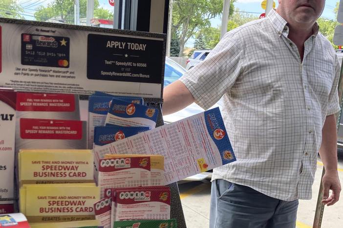 A customer walks in to the Speedway gas station in Des Plaines, Ill., where the winning Mega Millions lottery ticket was sold on July 30. Two people who wish to remain anonymous have claimed the $1.337 billion jackpot, officials said Wednesday.