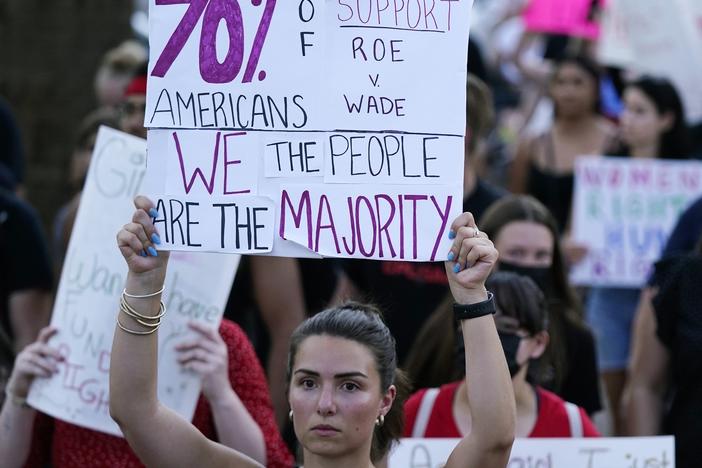 Protesters march around the Arizona Capitol in Phoenix after the Supreme Court decision to overturn Roe v. Wade. A new Arizona law banning abortions after 15 weeks of pregnancy takes effect Saturday, Sept. 24.