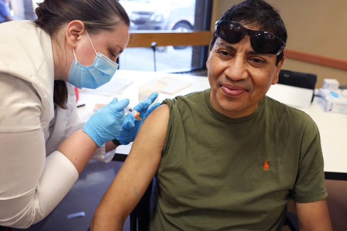 Gustavo Perez got his influenza vaccine from pharmacist Patricia Pernal in early September during an event hosted by the Chicago Department of Public Health at the city's Southwest Senior Center. This year's flu season may strike earlier and harder than usual, experts warn. A flu shot's your best protection.