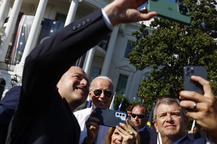 President Biden takes pictures with guests after speaking at an event celebrating the passage of the Inflation Reduction Act on the South Lawn of the White House on Sept. 13.