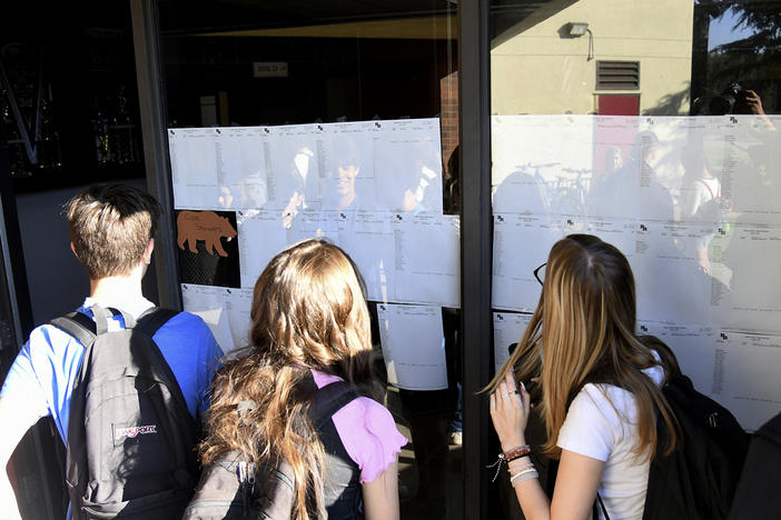 Students at Bear River High School in Grass Valley, Calif., gather to see their school schedules during the first morning of school in August.