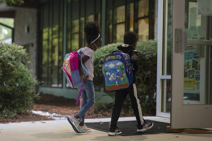 Students enter Atlanta's Beecher Hills Elementary School in August.