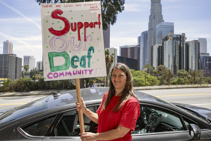A deaf mother of a hearing daughter supports a proposal to overhaul education for deaf and hard of hearing students in the Los Angeles Unified School District. Supporters of the proposal rally outside Los Angeles Unified School District Headquarters earlier this year in Los Angeles.