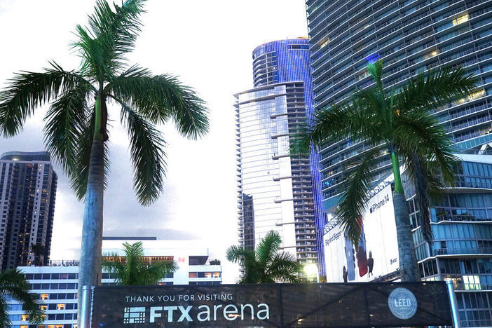 Signage for the FTX Arena, where the Miami Heat basketball team plays, is visible Saturday in Miami. Sam Bankman-Fried received numerous plaudits as the head of cryptocurrency exchange FTX: the savior of crypto, the newest force in Democratic politics and potentially the world's first trillionaire. Now the comments about the 30-year-old aren't so kind.