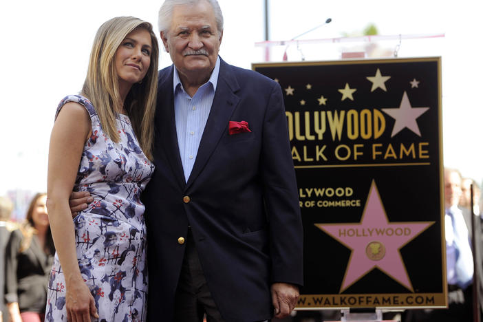 Actress Jennifer Aniston, left, poses with her father, actor John Aniston, after she received a star on the Hollywood Walk of Fame in Los Angeles in 2012. John Aniston, the Emmy-winning star of the daytime soap opera "Days of Our Lives" and father of Jennifer Aniston, has died at age 89.