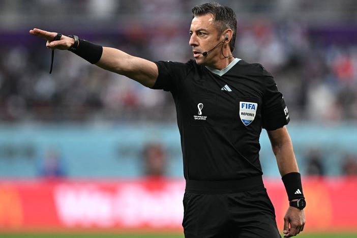 Brazilian referee Raphael Claus gestures during the Qatar 2022 World Cup soccer match between England and Iran at the Khalifa International Stadium in Doha on Monday. Claus added 29 minutes of stoppage time to the game - part of a growing trend at this tournament.