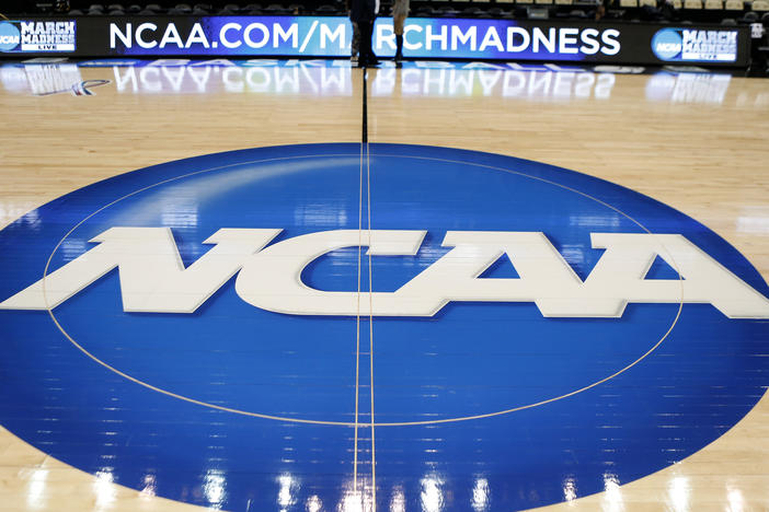 In this March 18, 2015, file photo, an NCAA logo is displayed at center court as work continues at The Consol Energy Center in Pittsburgh, for the NCAA college basketball second and third round games.