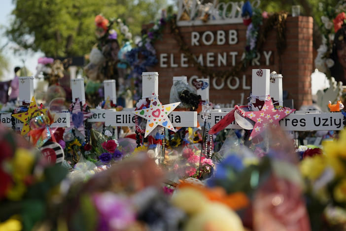 Crosses, flowers and other memorabilia form a make-shift memorial for the victims of the shootings at Robb Elementary School in Uvalde, Texas.