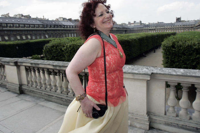 Photographer Nan Goldin poses after being awarded Commander in the Arts and Letters Order, in Paris, June 27, 2006.