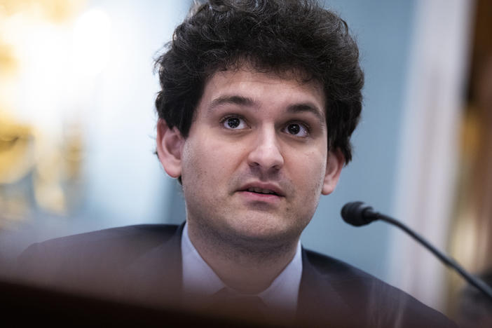 Sam Bankman-Fried's crypto empire abruptly collapsed last month. Now he's facing multiple criminal fraud charges over the handling of billions of dollars by the FTX platform. He's seen here speaking during a House Agriculture Committee hearing in May.