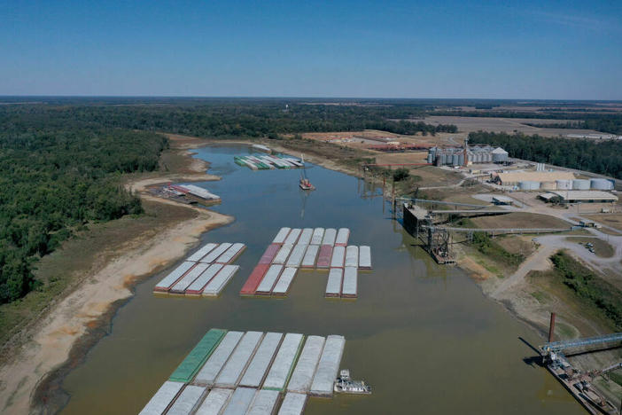 Barges were stranded by low water levels along the Mississippi River in October, driving up shipping prices and threatening crop exports and fertilizer shipments. Scientists at the University of Memphis expect more dramatic swings in water levels on the river due to climate change.