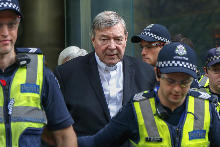 Cardinal George Pell, center, the most senior Catholic cleric to face sex charges, leaves court in Melbourne, Australia, May 2, 2018. Pell, who was the most senior Catholic cleric to be convicted of child sex abuse before his convictions were later overturned, died on Tuesday in Rome at age 81.