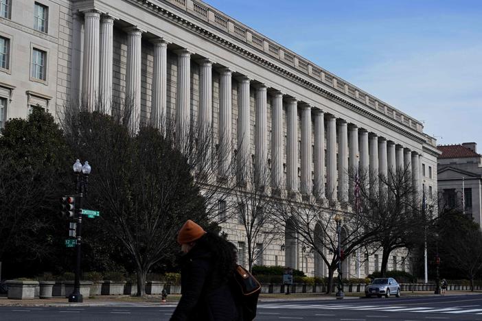 The IRS says people who got money from special rebates and payments from their states should wait to file tax returns if they're not sure if the money is taxable. The IRS headquarters building in Washington, D.C., is seen here on Jan. 10.
