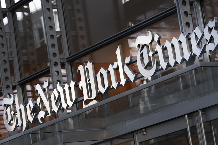 A sign for The New York Times hangs above the entrance to its building on May 6, 2021 in New York.