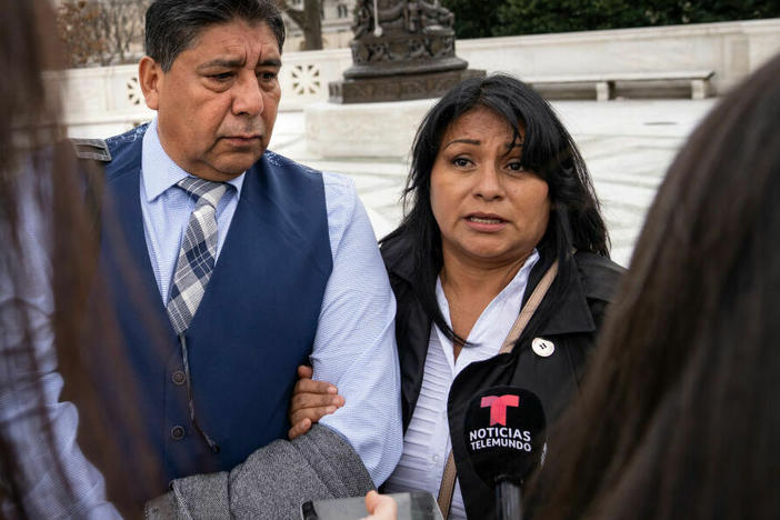 Jose Hernandez and Beatriz Gonzalez, stepfather and mother of Nohemi Gonzalez, who died in a terrorist attack in Paris in 2015, talk Tuesday to reporters outside the U.S. Supreme Court following oral arguments in Gonzalez v. Google.