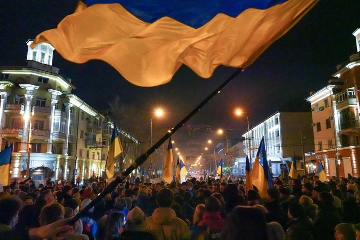 Residents of Mariupol, Ukraine, gather for a second night to show support for their city in the wake of Russia's latest political statements and military actions on Feb. 22, 2022 — two days before Russia's full-scale invasion would begin.