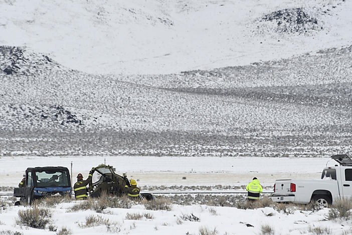 A Care Flight medical transport plane carrying a patient and four others that crashed the day before is seen Saturday, Feb. 25, 2023, in Lyon County, Nev. All five people on board were killed.