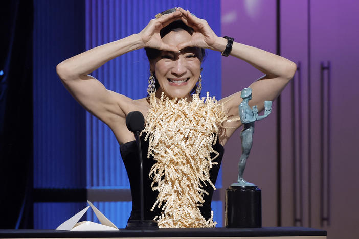 Michelle Yeoh accepts the SAG award for Outstanding Performance by a Female Actor in a Leading Role for <em>Everything Everywhere All at Once</em>.