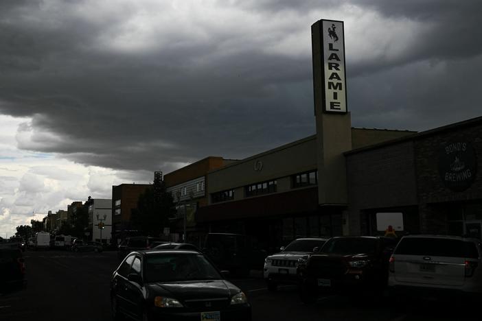 Serial's new true-crime podcast, <em>The Coldest Case in</em> Laramie, revisits a 1985 murder<em>. </em>Above, storm clouds over downtown Laramie, Wyo., on Aug. 13, 2022.