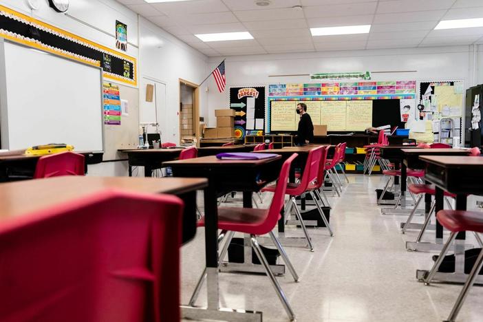 A Louisville, Ky., classroom sits empty in January 2022, during a COVID surge driven by the omicron variant. Students lost the routine of going to school during the pandemic, and now many are struggling to get back in the habit.