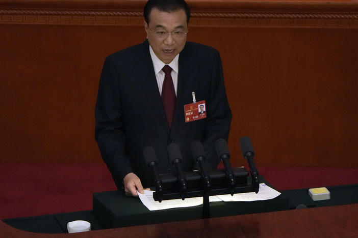 Chinese Premier Li Keqiang speaks during the opening session of China's National People's Congress (NPC) at the Great Hall of the People in Beijing, Sunday, March 5, 2023.