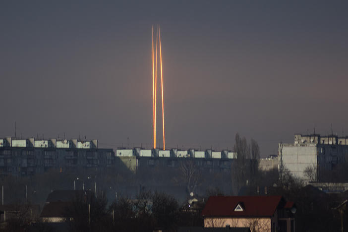 Three Russian rockets launched against Ukraine from Russia's Belgorod region are seen at dawn in Kharkiv, Ukraine, late Thursday, March 9, 2023.