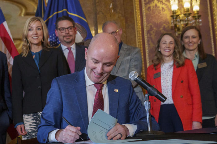 Gov. Spencer Cox signs two social media regulation bills during a ceremony at the Capitol building in Salt Lake City on Thursday, March 23, 2023. Cox signed a pair of measures that aim to limit when and where children can use social media and stop companies from luring kids to the sites.