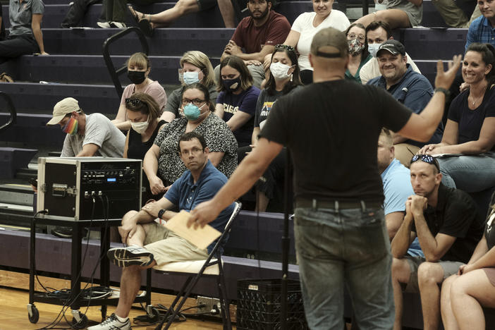 People speak during a special Board of Education Meeting on mask mandates for students and staff in Kalamazoo County Schools at the Schoolcraft High School Gymnasium on August 23, 2021 in Schoolcraft, Michigan. The Schoolcraft Local School District opened the floor for public discussion.