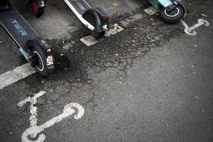 Scooters are parked in Paris, Friday, March 31, 2023.