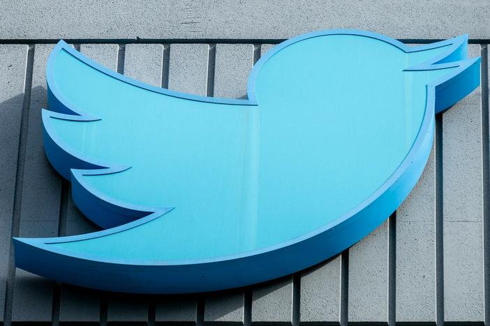 The Twitter logo is seen on a sign on the exterior of Twitter headquarters in San Francisco, California, on October 28, 2022.