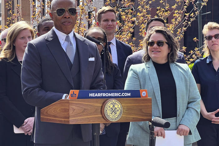 New York Mayor Eric Adams, left, introduces Kathleen Corradi, center, as the first-ever citywide director of rodent mitigation, also known as the "rat czar."