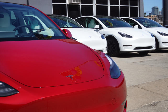 Tesla cars sit on a lot in Chicago on March 28, 2022. A $7,500 tax credit for purchasers of new electric vehicles is changing again after the U.S. unveiled new guidelines that will impact the list of car models that qualify.