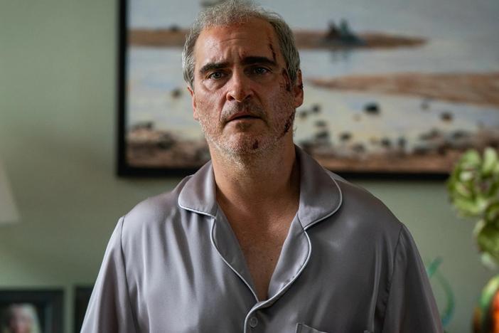 Joaquin Phoenix's character is attacked, tortured, threatened, knocked unconscious and terrorized in Ari Aster's <em>Beau is Afraid.</em>