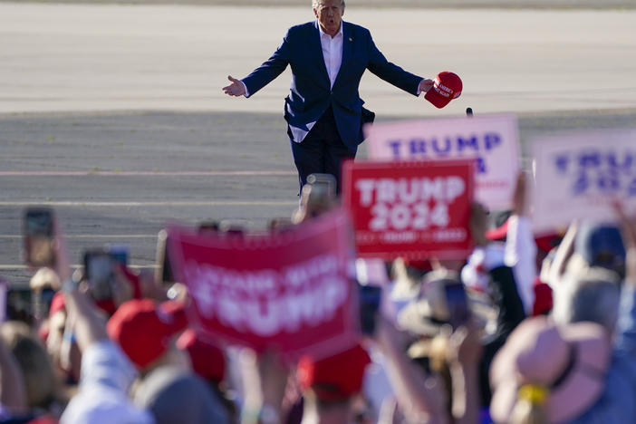 Former President Donald Trump walks across the tarmac as he arrives to speak at a campaign rally at Waco Regional Airport on March 25 in Waco, Texas.