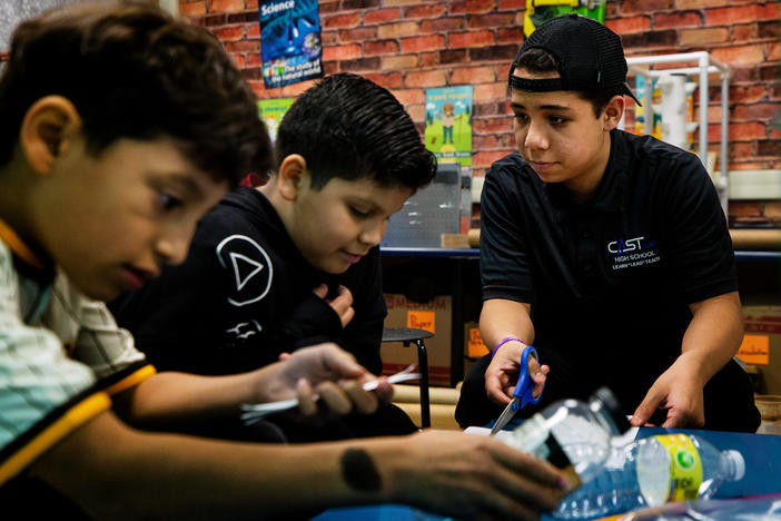 Christopher Olivarez, 15, helps students build model bottle rockets in Patrice Bravo's STEM lab at Nora Forester Elementary School in San Antonio, Texas.