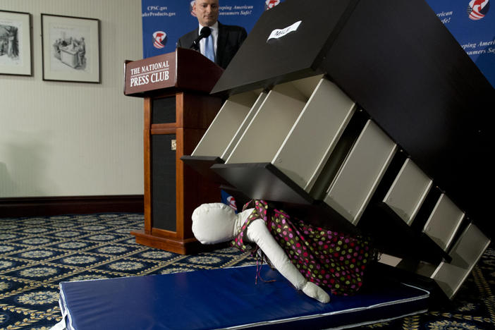 Former Consumer Product Safety Commission chairman Elliot Kaye watches a demonstration of how an Ikea dresser can tip and fall on a child during a news conference at the National Press Club in 2016.
