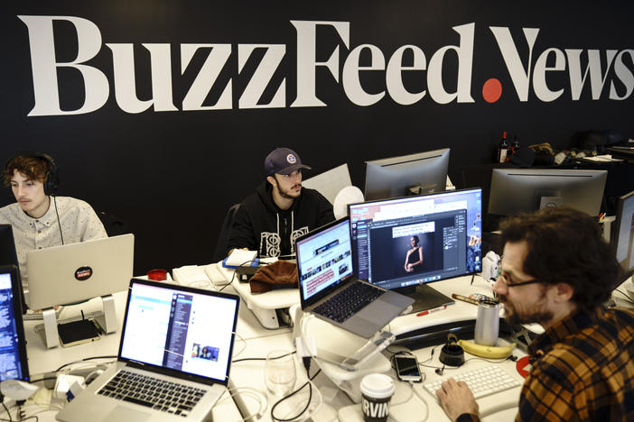 Members of the BuzzFeed News team work at their desks at BuzzFeed headquarters, December 11, 2018 in New York City.