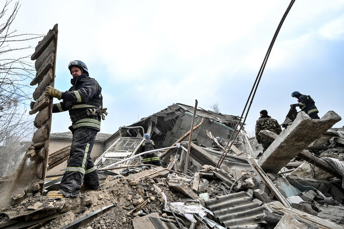 Rescuers remove rubble at the maternity ward of the Vilniansk Multidisciplinary Hospital in Ukraine, one of the countries experiencing an increase in violence against health care workers.