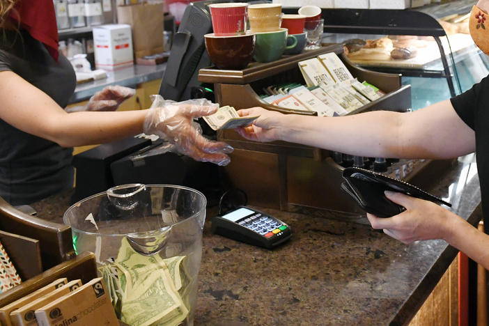 Tipping machines have replaced tip jars in many places as more people pay electronically.