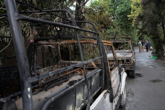 Burned remains of cars, which were torched by an angry mob during an attack in Imphal, Manipur.