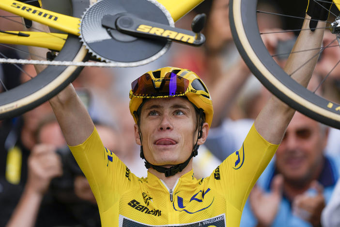 Tour de France winner Jonas Vingegaard, wearing the overall leader's yellow jersey, celebrates after the twenty-first stage of the Tour de France in Paris on Sunday.