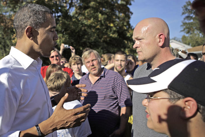 Barack Obama answers a question from Joe Wurzelbacher, also known as "Joe the Plumber," right, while campaigning for the White House in Holland, Ohio, Oct. 12, 2008.